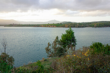 Lake and forest in an autumn evening