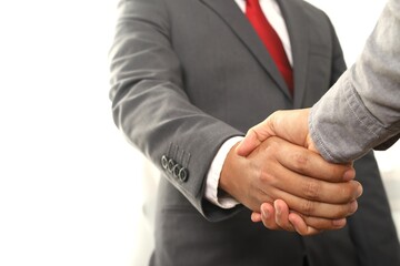 business people shake hands at the end of the meeting for cooperation and trust in business