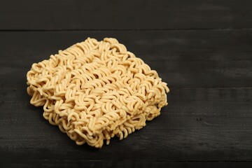 Semi-finished mama on black wooden floor