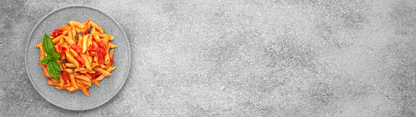 Top view Plate CHERRY TOMATO PASTA Like an Italian on grey background with copy space banner
