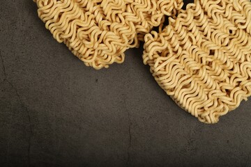raw instant noodles on gray background