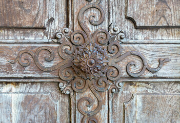 Detail of a beautiful old wooden door of Church Maria Strassengel, a 14th century Gothic pilgrimage church in the town of Judendorf Strassengel near Graz, Styria region, Austria