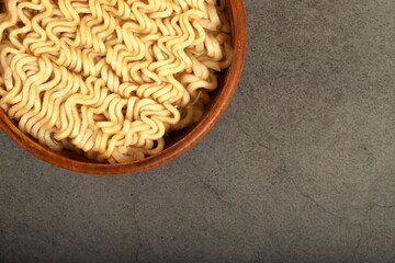 ready-to-eat instant noodles on gray background
