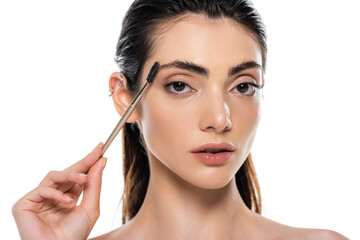 Obraz premium young woman styling eyebrow isolated on white