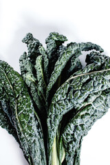 Fresh black kale from the garden on a white background
