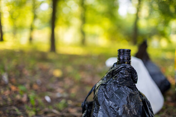 bottle of alcohol hidden in package, outdoor recreation, summer