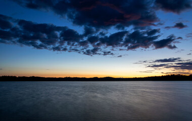 Fototapeta na wymiar Midnight landscape on Swedish lake