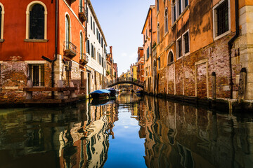 city canal with reflections in venice