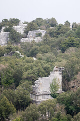 panoramic view from the top of the mountain to the ruins of ancient abandoned city Termessos in Turkey