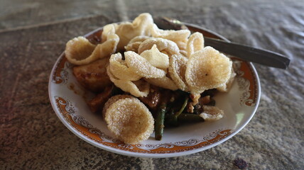mixed vegetables with the peanut sauce in a plate