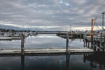 Fototapeta premium Clouds reflecting on the water at Blaine Harbor in Blaine, Washington