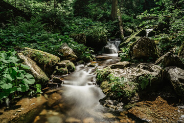 Waterfalls on the river Bila Opava,Jeseniky Mountains,Czech Republic.Deep valley,lush green...