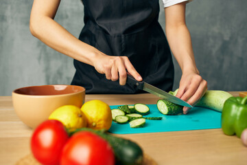 Obraz na płótnie Canvas housewife lunch at home vegetarian food cutting board