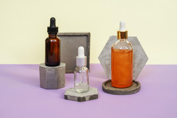 Front view of different face serum bottles.