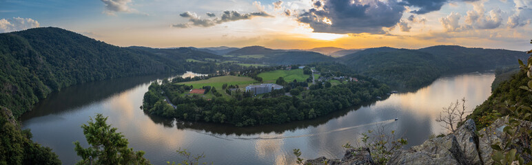 Fototapeta na wymiar Vltava river horseshoe shape meander from Albert viewpoint close to Smilovice,Czech Republic.Beautiful landscape with river canyon at sunset.Panoramic view of Czech countryside with water reflection