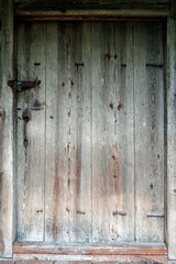 Texture. Background. A door to a rural house in the village. Natural materials. Knocked down by nails