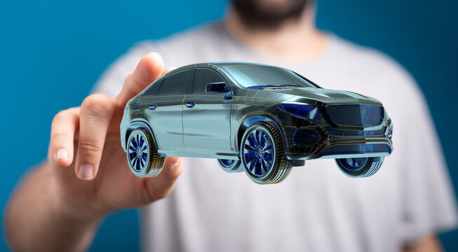 Man holding and touching holographic smart car