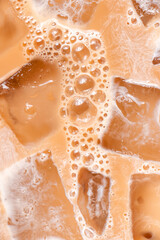 Close up of iced coffee with cream and bubbles