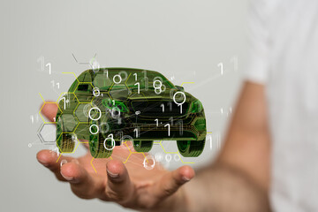 Man holding and touching holographic smart car