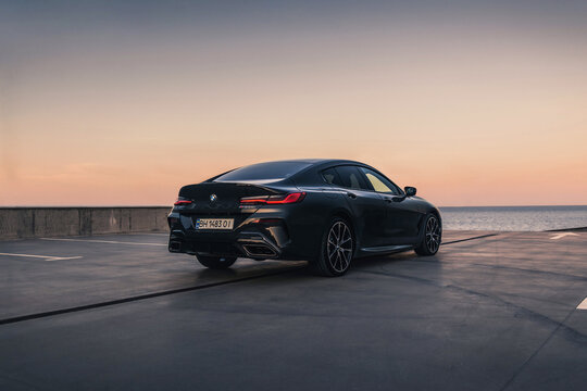 Brand new BMW M850i Gran Coupe on the parking on the background of sunset. Odessa, Ukraine - August 2021.