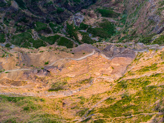 Drop down view of trail following volcanic mountain ridge.