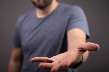 man mid section with hand out