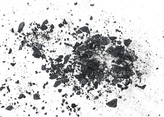Black dust powder of charcoal on a white background, top view. Charcoal dust with fragments.