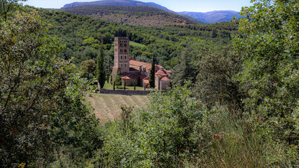 Fototapeta na wymiar Exterior view of the Abbey of St Michel de Cuxa in the countryside