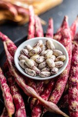 Cranberry beans in bowl. Beans pods