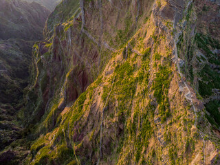 Aerial view of picturesque volcanic mountains at sunrise.