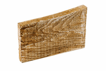 An old wooden board, eaten by pests.