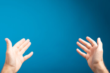 male  shows outstretched hand with open palm