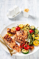 grilled salmon and vegetables on a plate
