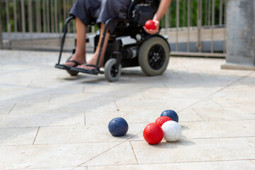 Disabled Boccia player playing on a wheelchair