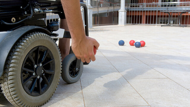 Disabled Boccia player playing on a wheelchair
