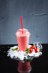 Milkshake ice cream in plastic cups with ice