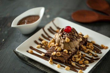brownies cake with ice cream and nuts
