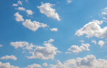 Naklejka na ściany i meble Blue sky background with white small air clouds