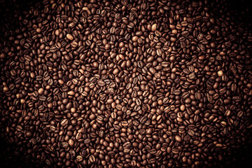 Сalibrated Arabica  сoffee beans poured into a solid layer on a surface table, blended, background, top view
