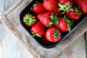 Organic strawberries in a tray. Fresh strawberries. Environmentally friendly products.