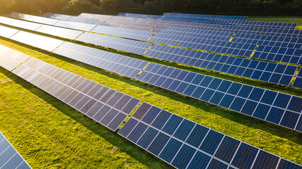 Solar power farm in the evening, fields of West Sussex, UK.