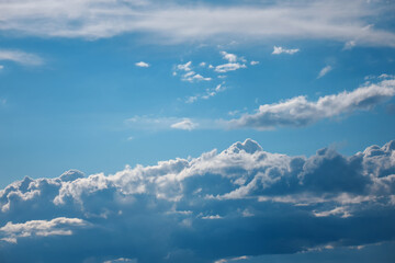 White clouds on blue sky. Natural cloudscape background.