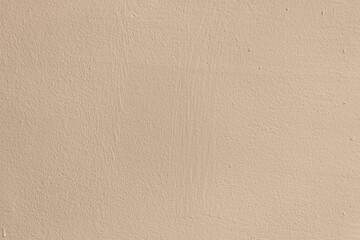 abstract background of painted beige wall close up