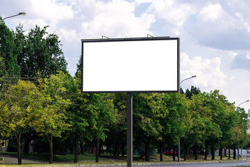 blank advertising billboard mockup. urban life. near park area. template for design. large advertising road banner
