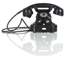 Old black telephone on white background