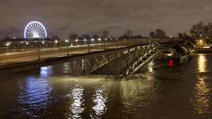 A bridge in Paris being flooded at night by the flood of 2018 