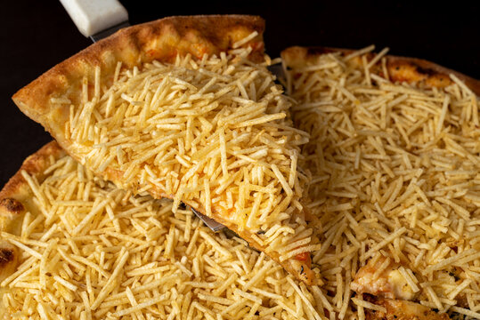 Piece of mozzarella cheese pizza with potato chips