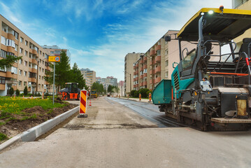 Fototapeta premium Road paving machine working on the street.