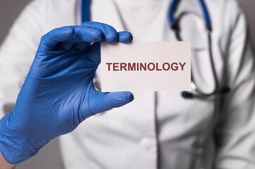 Medical terminology word in doctor hands. Medicine terms concept.