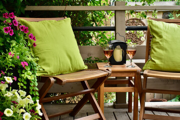 Outdoor oasis setting in secluded backyard deck at summer vacation rental in lush, luxury setting...